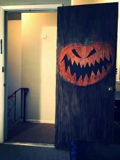 a door decorated to look like a pumpkin