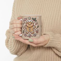 a woman holding a coffee mug with a ginger on it's front and side