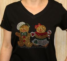 "Rhinestone Gingerbread Boy Girl Fun Christmas Bling V-Neck Ladies Shirt This cute Rhinestone Christmas Gingerbread couple is ready for the holidays! It is pictured on a black 100% Ringspun Cotton ladies v-neck Ladies V-Neck by LAT Underarm to underarm Small-18.5\"-19 Medium-19.25\"-19.38\" Large-21.5\"-22.75\" X-Large-23\" -25.5\" 2X-25.75\"-27\" 3X- 27\"-27.75\" Body Width Small-17.5 Medium -18.5 Large -20.75-21.75 X-Large -23\"-23.5\" 2X - 24.5\"-25.5\" 3X-27\"-27.75\" Body Length Small- 23.5 Gingerbread Couple, Holiday Tee Shirts, Christmas Bling, Silly Shirt, Beads Patterns, Ladies Shirt, Fun Christmas, Christmas Gingerbread, Holiday Shirts