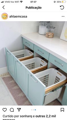 two baskets are in the bottom drawer of a cabinet