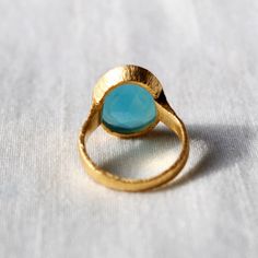 D E T A I L S - Material: Sterling silver 925 Stone: Aqua Chalcedony The fit: True to US ring size Finish: Smooth and Gold Plated to a high shine S H I P P I N G & P R O D U C T I O N - My current production time is 2-6 business days, which means after those days are up, your order ships! I make everything custom to order, by hand, but I promise you it's worth the wait! R U S H - M Y - O R D E R - If you're in a rush to get your pretty new pieces, please send me a message and I'll let you kn Yellow Gold Chalcedony Ring Gift, Chalcedony Rings Fine Jewelry For Gift, Cabochon Open Ring For Jewelry Making, Fine Jewelry Chalcedony Gemstone Rings, Handmade Chalcedony Rings For Weddings, Round Opal Ring As Gift, Cabochon Open Ring For Anniversary, Cabochon Open Ring Gift, Handmade Chalcedony Rings For Anniversary