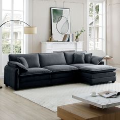 a living room with a sectional couch and coffee table