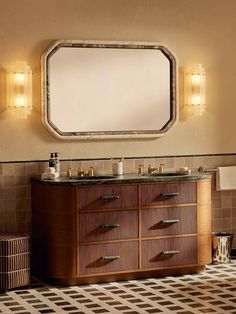 a bathroom vanity with two mirrors above it