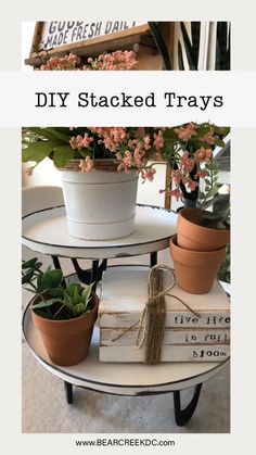 three tiered trays with flowers and books on them