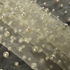 white pearls are on the sheer fabric