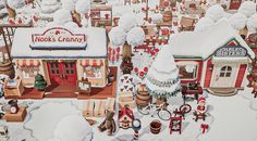 a painting of a christmas village with lots of toys