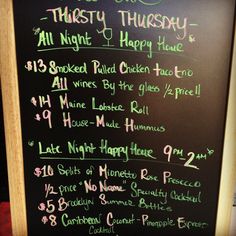 a chalk board with writing on it in front of a restaurant sign that says, this is twenty thursday all night i happy hour