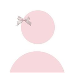 a pink circle with a white bow on it