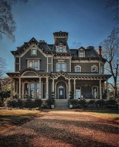 an old house with many windows and stairs