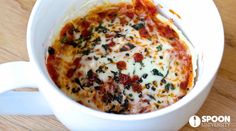 a close up of a bowl of food on a table