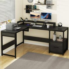 a computer desk sitting on top of a hard wood floor next to a white wall