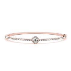 The Round Halo Diamond Bangle Bracelet presents a brilliant round shaped diamond accented at the center encircled beautifully by a majestic halo studded with small sparkling stones in a classic prong setting. The delicate bangle bracelet is further emblazoned with dazzling round shaped stones adding radiance and grace to your appeal.  Round cut center stone of 0.60 ct. with Clarity SI2 and Color H and side stones of 1.15 ct. with Clarity SI2 and Color G in a prong setting. Total Carat Weight:- 1.75 Total Number of Stones:- 56 This round halo diamond bangle bracelet can also be obtained in a wide variation of glossy metals as per your liking. Free shipping within USA. 1 Year Manufacturing Warranty. Schedule a one hour special appointment with our jewelry specialist only at our New York Real Diamond Necklace, White Gold Bangle, Halo Diamond Earrings, Diamond Bangle Bracelet, Pave Bracelet, Diamond Bracelet Design, Round Halo, Diamond Bangles Bracelet, Gold Halo