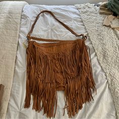 En Shalla Leather Fringe Bag Beige Leather Bags With Fringe, Leather Bags With Adjustable Strap, Leather Satchel Fashion Accessory Bag, Leather Crossbody Bags As Fashion Accessory, Beige Leather Bohemian Hobo Bag, Beige Bohemian Leather Hobo Bag, Bohemian Beige Leather Hobo Bag, Chic Camel Tote Shoulder Bag, Camel Shoulder Bag With Adjustable Strap