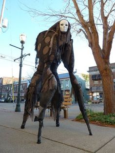 a man in costume walking down the street