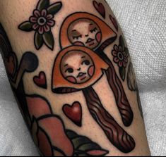 a close up of a person's leg with tattoos on it and an image of a woman holding a baby