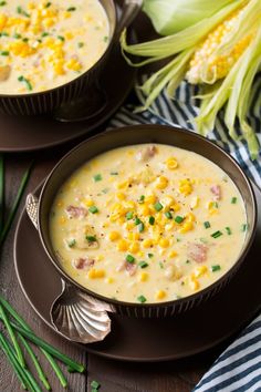 two bowls filled with corn chowee on top of a table