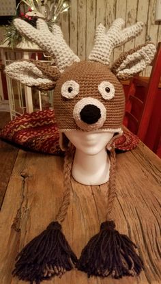 Perfect Crochet Deer hat for that hunter in your life or just to wear for fun on a crisp day in the woods or with friends in town.  Very warm, soft  and has stuffed antlers and muzzle. May customize colors and/or size.  Adult size shown.  Available in both Child and Adult sizes. May also made without earflaps. Please make let me know in comment when ordering which size you need. Price is same for all sizes due to the amount of work that go into this hat. Tax included in price Winter Camping Hat, One Size Fits Most, Winter Camping Cap, Playful Brown Winter Hat, Adjustable Warm Winter Costume Hats And Headpieces, Winter Hunting Hats With Adjustable Fit, Adjustable Winter Hunting Hat, Playful Brown Hat, One Size Fits Most, Playful Brown Cap Hat, Playful Brown Cap