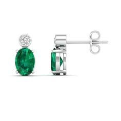 These exquisite emerald and diamond stud earrings are a timeless and elegant addition to any jewelry collection. The vibrant green emeralds are beautifully complemented by the sparkling diamonds, creating a stunning contrast that is sure to catch the eye. Metal: 14K Gold Setting Type: Prong Rhodium Finish: Yes, on White Gold Gemstone Details: Gemstone: Emerald Shape: Oval Average Dimensions: 7.00 x 5.00 MM Quantity: 02 Average Cut: Very Good Average Color: Medium to Dark Green Average Clarity: E Green Brilliant Cut Diamond Earrings, Green Diamond Earrings In Fine Jewelry Style, Green Diamond Earrings Fine Jewelry, Green Diamond Earrings With Diamond Accents, Green Emerald Diamond Earrings With Prong Setting, Green Emerald Diamond Earrings For Anniversary, Green Emerald Diamond Earrings, Green Diamond Earrings For May Birthstone, Green Gemstone Diamond Earrings