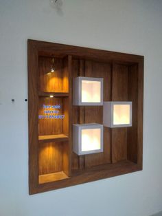 a wooden shelf with lights inside of it