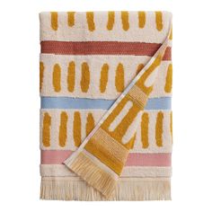 a yellow and white towel with a brush on it