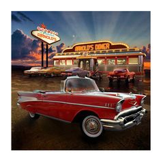 an old red car parked in front of a diner at dusk with the lights on