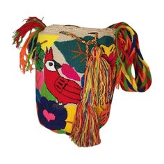 Introducing our exquisite Wayuu Bag, a stunning blend of tradition and contemporary style. Handcrafted by skilled artisans from the indigenous Wayuu community in Colombia and Venezuela, each bag is a masterpiece of intricate weaving and vibrant colors. With a diameter ranging from 9 to 13 inches and a matching depth, this bag strikes the perfect balance between functionality and elegance. Its compact yet spacious design allows you to carry your essentials with ease while adding a touch of unique Mochila Bag, Wayuu Bag, Punch Needle, Unique Charms, Handmade Crochet, Accessories Shop, Contemporary Style, Gift For Her, Bag Accessories