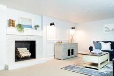 a living room filled with furniture and a fire place