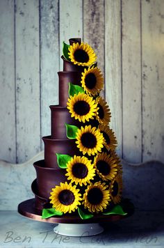 a chocolate cake with sunflowers on top