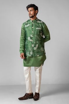 Sage green plain kurta with pintuck detailing. Paired with a floral printed Nehru Jacket with hand embroidered chid and tikki work and plain white pant. - Aza Fashions Traditional Green Nehru Jacket For Semi-formal Occasion, Festive Nehru Jacket With Stand Collar For Spring, Green Long Sleeve Sherwani For Spring, Spring Green Embroidered Sherwani, Spring Embroidered Green Sherwani, Green Embroidered Bandhgala For Spring, Embroidered Green Bandhgala For Spring, Spring Green Embroidered Bandhgala, Spring Festive Bandhgala With Stand Collar