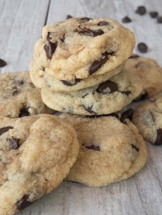 chocolate chip cookies are piled on top of each other