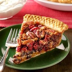 a slice of pecan pie on a green plate