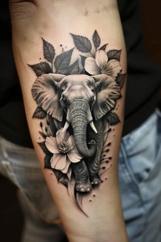 an elephant's head with flowers and leaves on the arm, done in black ink