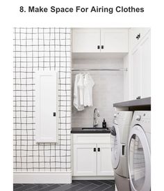 a washer and dryer in a white laundry room with black tile flooring