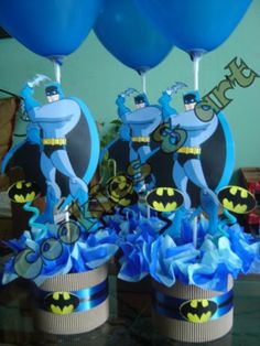 batman centerpieces with blue balloons in the middle and on top of each other