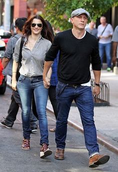 a man and woman walking down the street