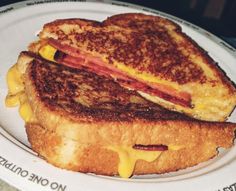 a grilled cheese and bacon sandwich on a plate