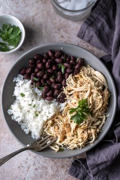 a bowl filled with rice, beans and meat