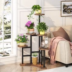 a living room filled with furniture and lots of potted plants on top of tables