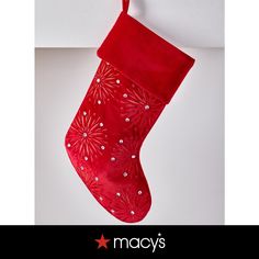 a red christmas stocking hanging on a wall