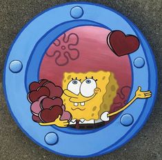 a cartoon character painted on the side of a blue frisbee with bubbles and hearts