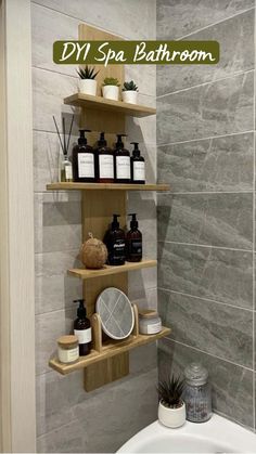 a bathroom with two shelves on the wall and a bathtub in the corner next to it