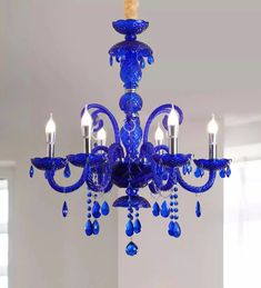 a blue chandelier hanging from the ceiling