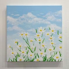 a painting of white daisies on a blue sky with green grass and clouds in the background