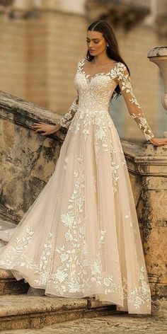 a woman in a wedding dress standing on steps with her hand on her hip and the words, 38 lace wedding dresses that you will absolutely love