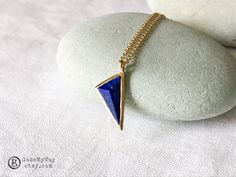 For sale: Authentic Chibi pendant  - Trianglular shape Vintage Lapis Lazuli pendant - Gold-plated Silver Pendant triangular shape. - The original chain is included - Stamped 925 Chibi and Chibi Jewels New York - Pendant Measuring about 16 mm/long side - Chain is about 44 cm long (about 17.25 inches) Condition: pre-owned with minor signs of wear.  Return Policy: All return shipping costs, including insurance and delivery confirmation, are the responsibility of the buyer. The returned item must be Geometric Yellow Gold Jewelry As Gift, Geometric Yellow Gold Jewelry For Gift, Geometric Yellow Gold Jewelry Gift, Geometric Yellow Gold Jewelry For Gifts, Blue Geometric Jewelry As A Gift, Blue Geometric Jewelry For Gifts, Elegant Triangle Yellow Gold Jewelry, Elegant Yellow Gold Triangle Jewelry, Triangle Brass Jewelry Gift