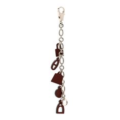 a key chain with hearts and keys hanging from it's end, on a white background