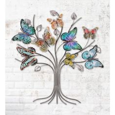 a metal tree with colorful butterflies on it