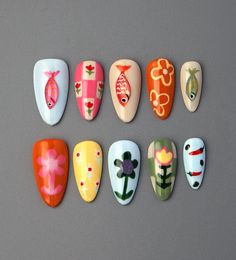 ❤Handmade❤ ❤Unique❤ ❤Reusable❤ ❤Hello, dear. Greetings and welcome to my store. Hope you find a style you like❤ ❤About Product❤ This colorful summer nail art is incredibly cute and fun! The flower, vegetable, and fish patterns on the press-on nails add a lively touch, making the nails burst with vibrant colors and a hint of playfulness. Such short almond nail art designs are full of joy and imagination. Wearing these nails is sure to bring a cheerful mood and showcase your personality charm. ❤Materials: gel❤ I only work with high-quality materials to create sturdy & long-lasting luxury press on nails that you can trust on. ❤Size:❤ XS: 15mm, 12mm, 13mm, 11mm, 9mm S: 16mm, 13mm, 14mm, 12mm, 9mm M: 17mm, 13mm, 14mm, 12mm, 10mm L: 18mm, 14mm, 15mm, 13mm, 11mm If you would like a custom size, p Short Almond Nail Art, Almond Nail Art Designs, Nail Short Almond, Fish Nail Art, Fish And Flowers, College Nails, Fish Nails, Nail Short, Almond Nail Art