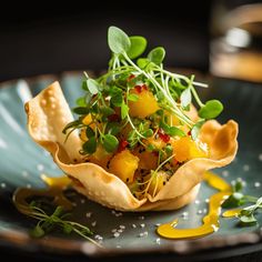 a plate with some food on it and garnished with green sprouts