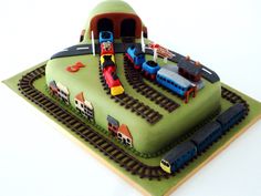 there is a cake that looks like a train station